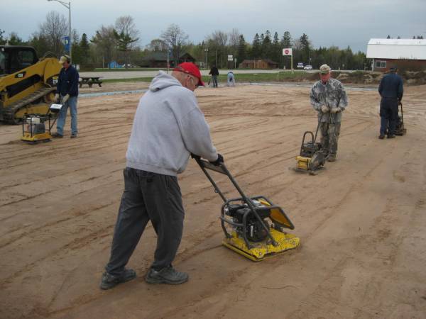 Compacting the sand