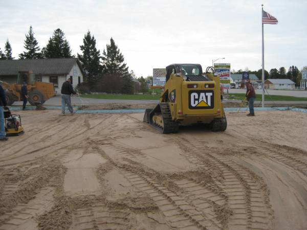 Compacting the sand